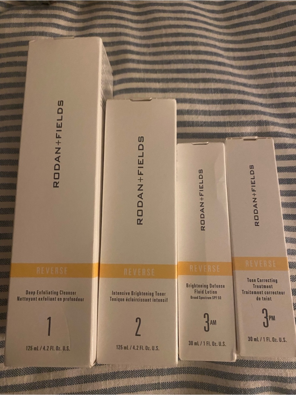 Rodan + Fields Reverse Skincare Set in White and Yellow Accent